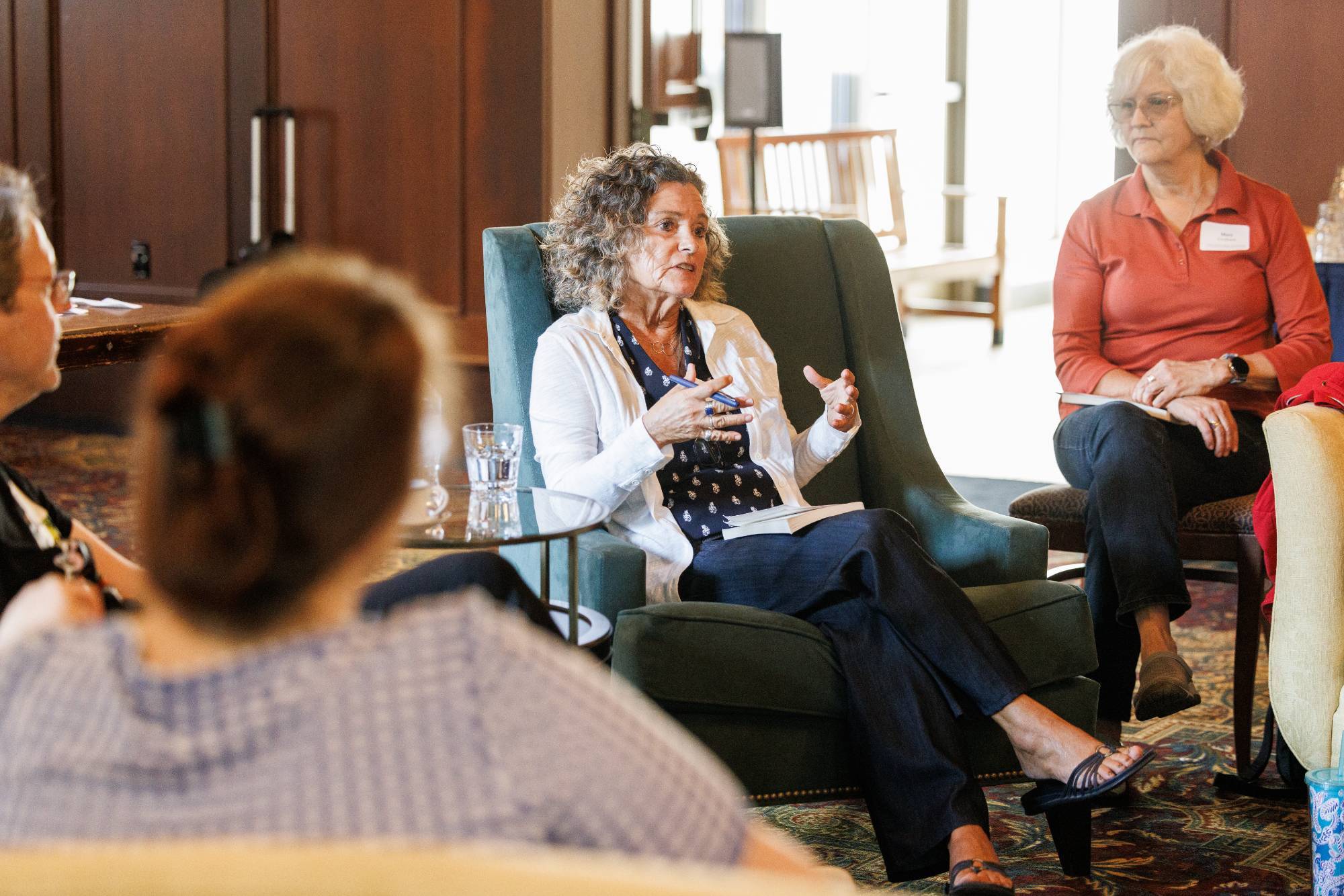 Open Minds Book Club attendees discuss a book.
